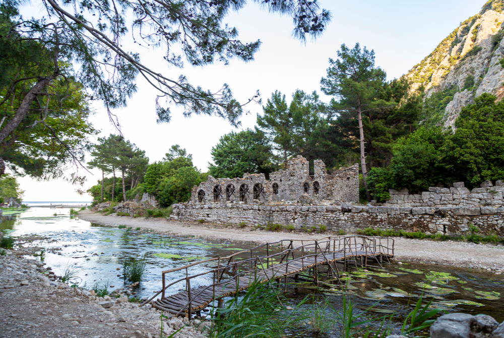 Olympos ancient city ruins along the freshwater river stream Antalya